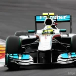 태그호이어 포뮬러1 모델 비교 - **Dynamic F1 Race Scene with TAG Heuer Formula 1 Watch:** A thrilling, action-packed close-up shot o...